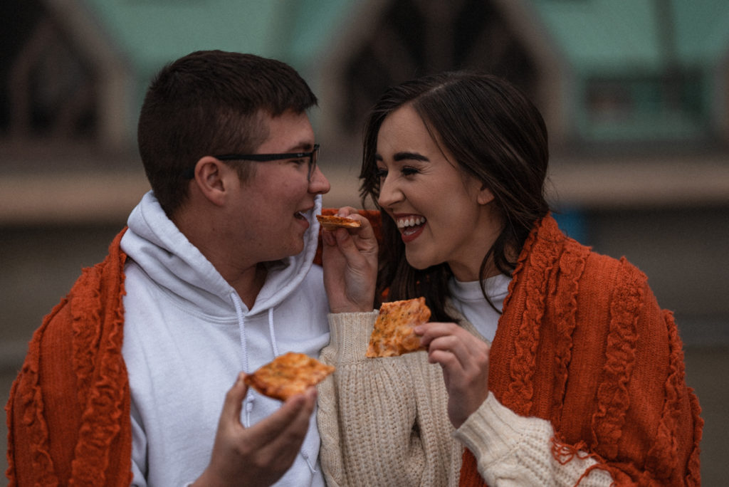 Adorable couple enjoys date night with imo's pizza on st louis rooftop