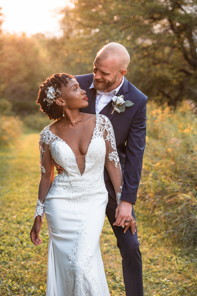 Couple enjoy golden hour in wildflower field at maidenwood weddings and events