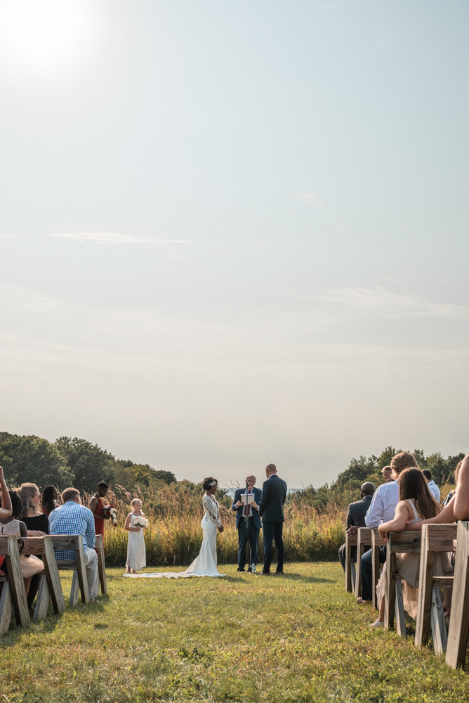 Ceremony begins at wedding venue overlooking Lake Pepin