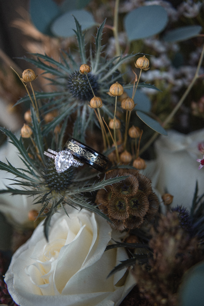 Stunning engagement ring and wedding bands on boho inspired florals